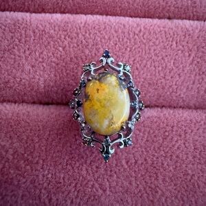 Elegant Silver and Yellow Gemstone Ring